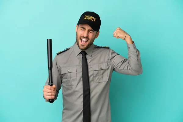 Young Security Man Isolated Blue Background Doing Strong Gesture — Foto de Stock