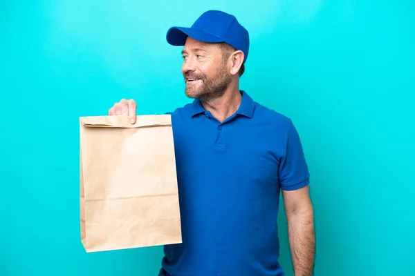 Middle Age Man Taking Bag Takeaway Food Isolated Blue Background — Stockfoto