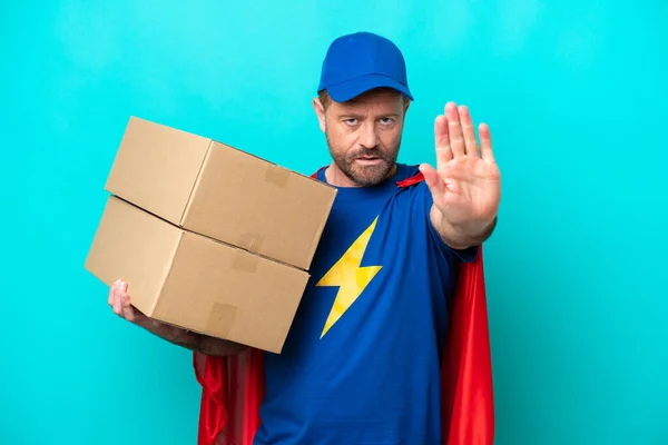 Super Hero Delivery Man Isolated Blue Background Making Stop Gesture — 스톡 사진