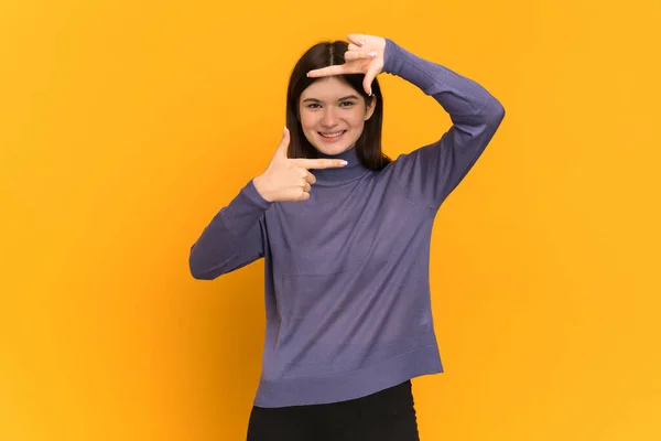 Young Ukrainian Girl Isolated Yellow Background Focusing Face Framing Symbol — Stock Photo, Image