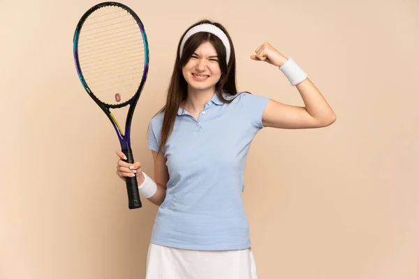 Young Ukrainian Girl Tennis Player Isolated Wall Doing Strong Gesture — Stockfoto