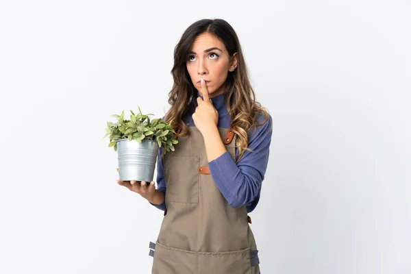Gardener Girl Holding Plant Isolated White Background Having Doubts While — Foto de Stock