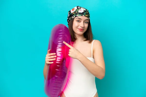 Young Ukrainian Woman Holding Air Mattress Isolated Blue Background Pointing — Foto de Stock