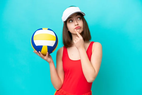 Young Ukrainian Woman Playing Volleyball Beach Isolated Blue Background Having — Stok fotoğraf