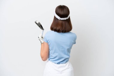 Young Ukrainian woman isolated on white background playing golf