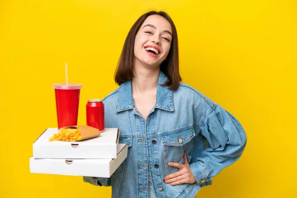 Young Ukrainian Woman Holding Fast Food Isolated Yellow Background Posing — Stock Photo, Image