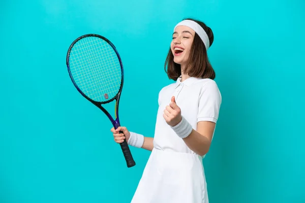 Young Ukrainian Woman Isolated Blue Background Playing Tennis Celebrating Victory — Stock fotografie