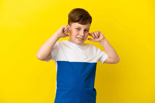 Little Redhead Boy Isolated Yellow Background Frustrated Covering Ears — Photo