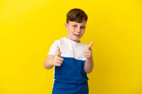 Little Redhead Boy Isolated Yellow Background Pointing Front Smiling — Foto de Stock