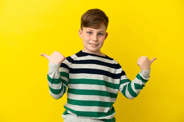 Little Redhead Boy Isolated Yellow Background Thumbs Gesture Smiling — 图库照片