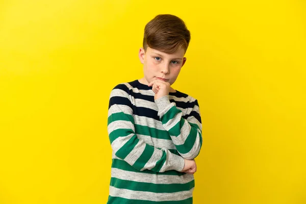 Little Redhead Boy Isolated Yellow Background Thinking Idea While Looking — Φωτογραφία Αρχείου