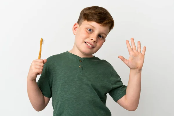 Little Redhead Boy Holding Toothbrush Isolated White Background Saluting Hand — Fotografia de Stock