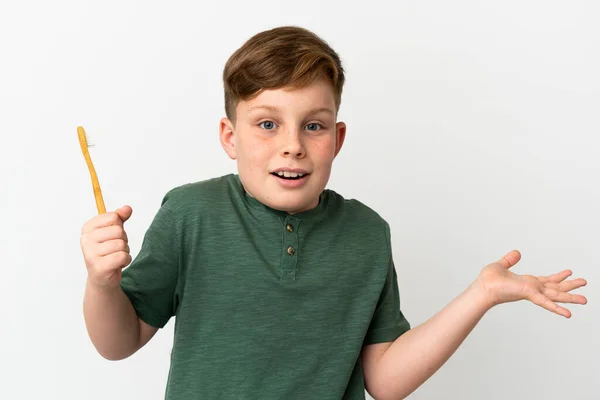 Little Redhead Boy Holding Toothbrush Isolated White Background Shocked Facial — Photo