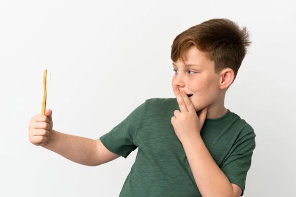 Little Redhead Boy Holding Toothbrush Isolated White Background Surprise Shocked — Stock Photo, Image