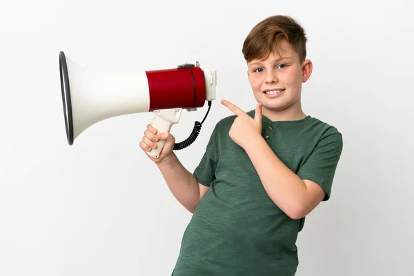 Little Redhead Boy Isolated White Background Holding Megaphone Pointing Side — Photo