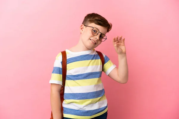 Little Redhead Caucasian Boy Isolated Pink Background Saluting Hand Happy — Stock Fotó