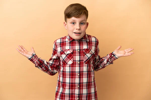 Little Redhead Boy Isolated Beige Background Shocked Facial Expression — Photo