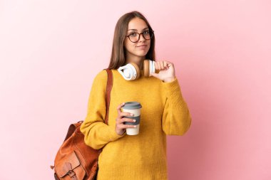 Young student woman over isolated pink background proud and self-satisfied