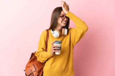 Young student woman over isolated pink background has realized something and intending the solution