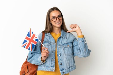 Young hispanic woman holding an United Kingdom flag over isolated white background proud and self-satisfied