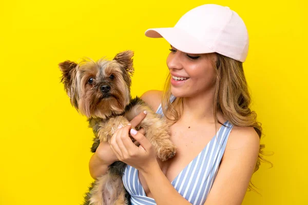 Young Caucasian Woman Holding Puppy Isolated Yellow Background — стоковое фото