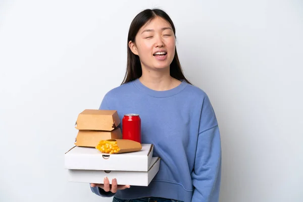 Young Chinese Woman Holding Fast Food Isolated White Background Laughing — Fotografia de Stock