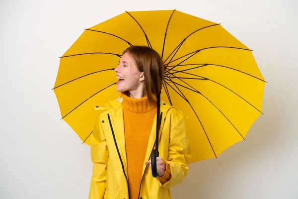 Mladá Anglická Žena Nepromokavým Pláštěm Deštníkem Izolované Bílém Pozadí Smějící — Stock fotografie