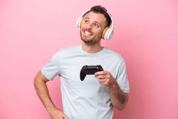 Young Brazilian Man Playing Video Game Controller Isolated Pink Background —  Fotos de Stock