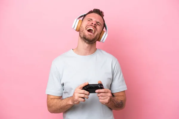 Young Brazilian Man Playing Video Game Controller Isolated Pink Background —  Fotos de Stock