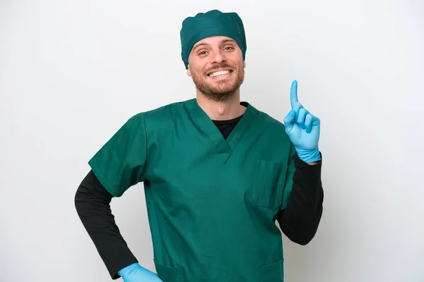 Surgeon Brazilian Man Green Uniform Isolated White Background Showing Lifting — Φωτογραφία Αρχείου