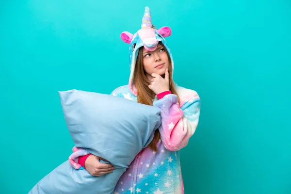 Young Caucasian Girl Unicorn Pajamas Holding Pillow Isolated Blue Background — Stock Photo, Image