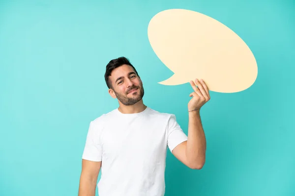 Jonge Knappe Blanke Man Geïsoleerd Blauwe Achtergrond Met Een Lege — Stockfoto