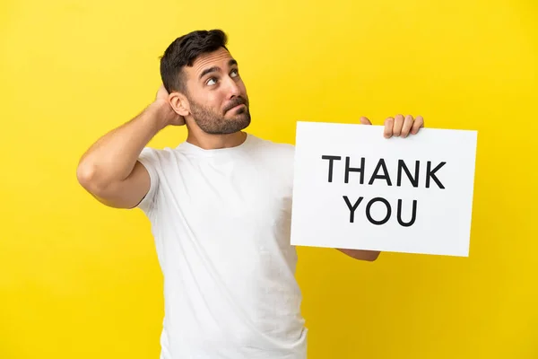 Young Handsome Caucasian Man Isolated Yellow Background Holding Placard Text — Stock Fotó