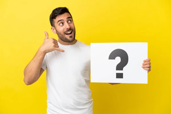 Young Handsome Caucasian Man Isolated Yellow Background Holding Placard Question — Stockfoto