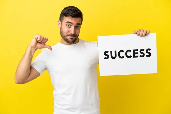 Young Handsome Caucasian Man Isolated Yellow Background Holding Placard Text — Stock Fotó