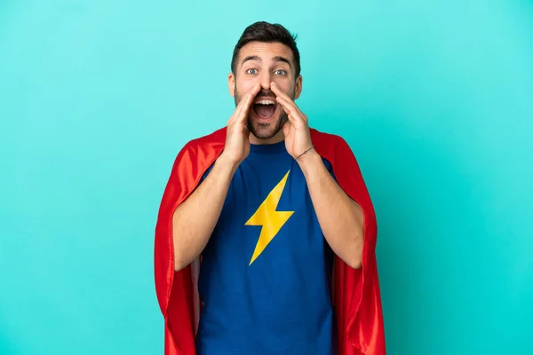 Super Hero Caucasian Man Isolated Blue Background Shouting Announcing Something — Stock Fotó