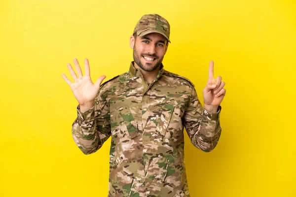 Military Man Isolated Yellow Background Counting Six Fingers — Photo