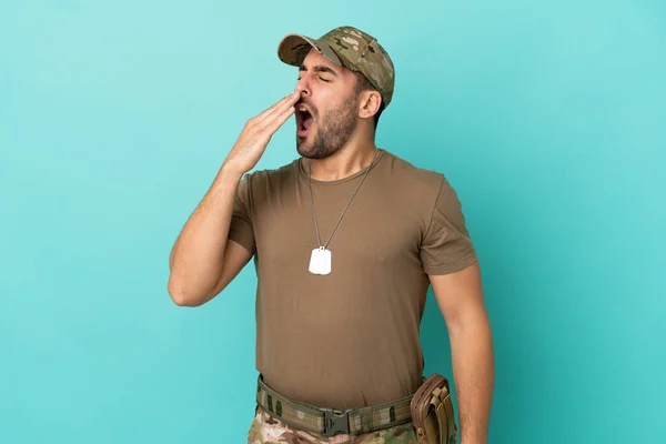 Military Dog Tag Isolated Blue Background Yawning Covering Wide Open — 图库照片