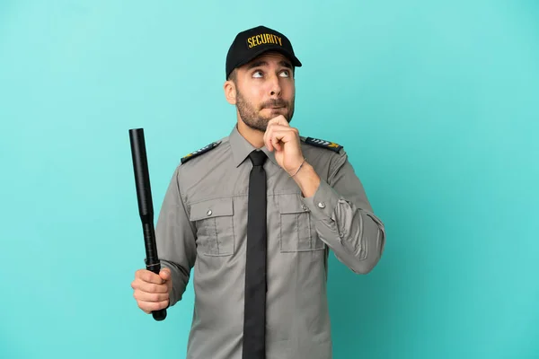 Young Security Man Isolated Blue Background Having Doubts Thinking — Foto Stock