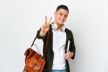 Young caucasian student man isolated on white background smiling and showing victory sign