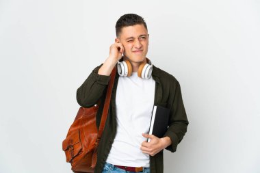 Young caucasian student man isolated on white background frustrated and covering ears