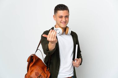 Young caucasian student man isolated on white background inviting to come with hand. Happy that you came