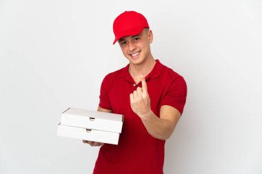 Pizza delivery man with work uniform picking up pizza boxes isolated on white background doing coming gesture