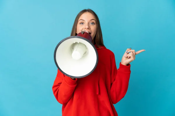 Young Lithuanian Woman Isolated Blue Background Shouting Megaphone Pointing Side —  Fotos de Stock