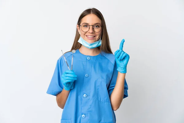 Lithuanian Woman Dentist Holding Tools Isolated Background Pointing Great Idea — Zdjęcie stockowe