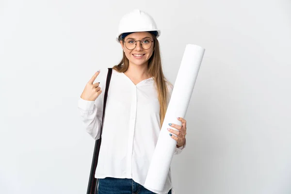 Young Lithuanian architect woman with helmet and holding blueprints isolated on white background giving a thumbs up gesture