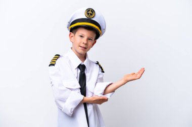 Little airplane pilot boy isolated on white background extending hands to the side for inviting to come