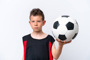 Boy playing football over isolated white wall