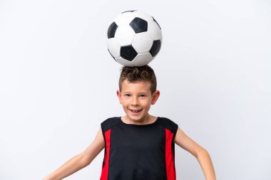 Boy playing football over isolated white wall