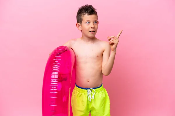 Little Caucasian Boy Holding Inflatable Donut Isolated Pink Background Intending — Photo
